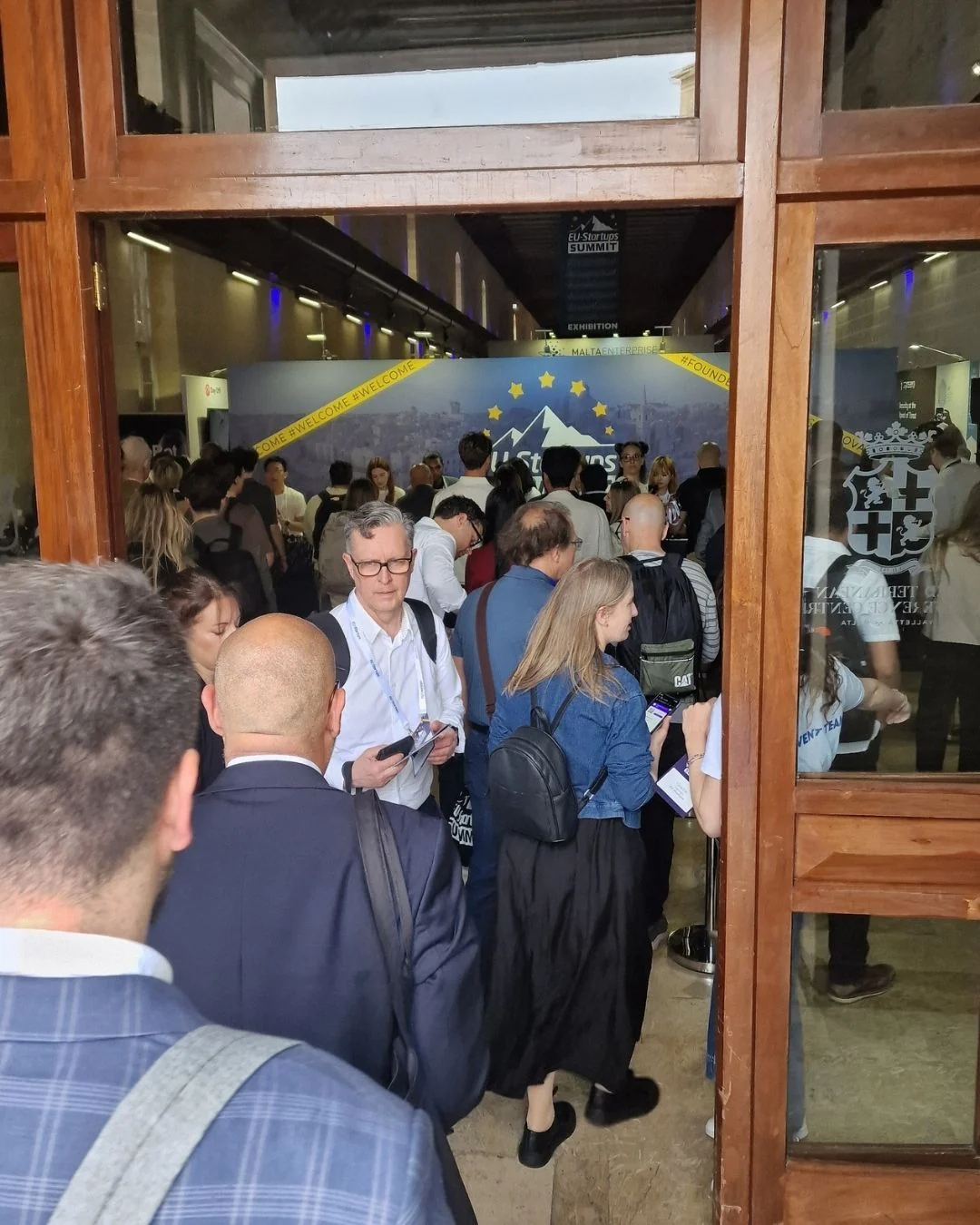 Visitors entering the EU-Startups Summit exhibition area