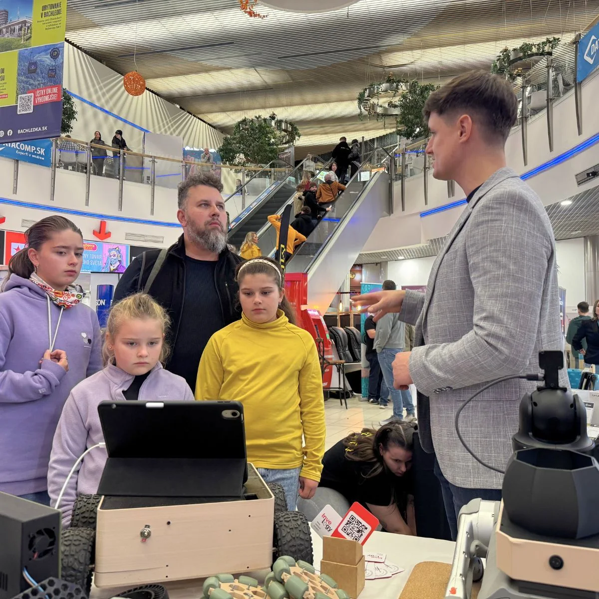 Children watching on a tablet what the robot sees