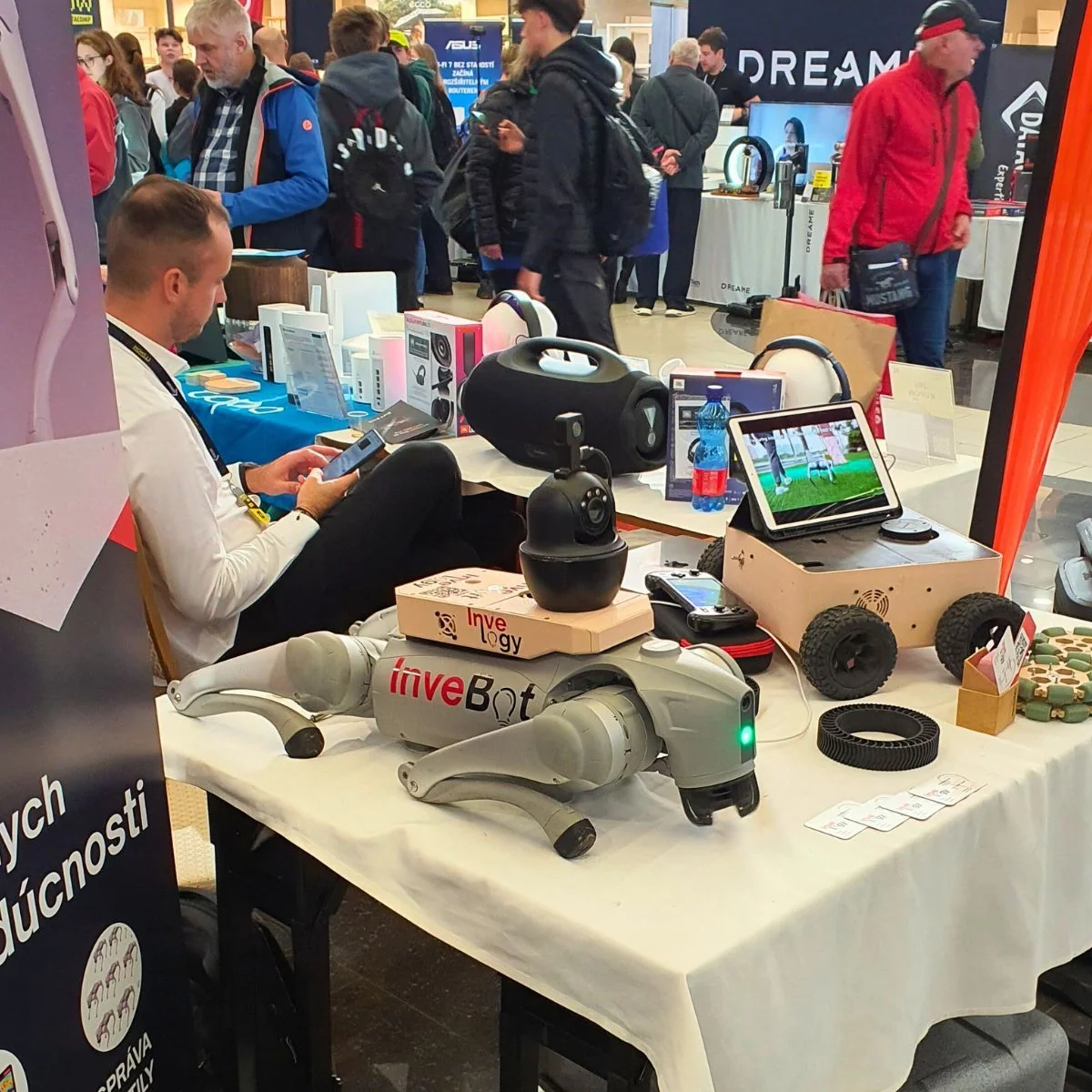 Our stand at OC Optima – a robot dog, a wheeled-robot prototype and a tablet with the live camera feed