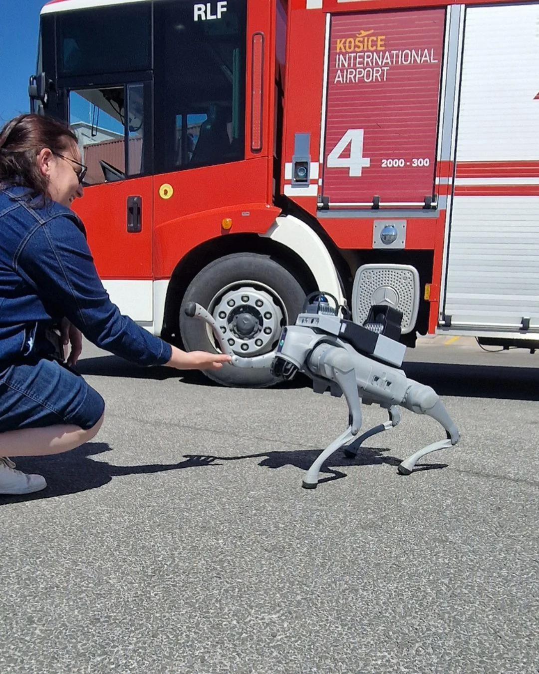 Quadruped robot alongside a fire engine at Košice Airport