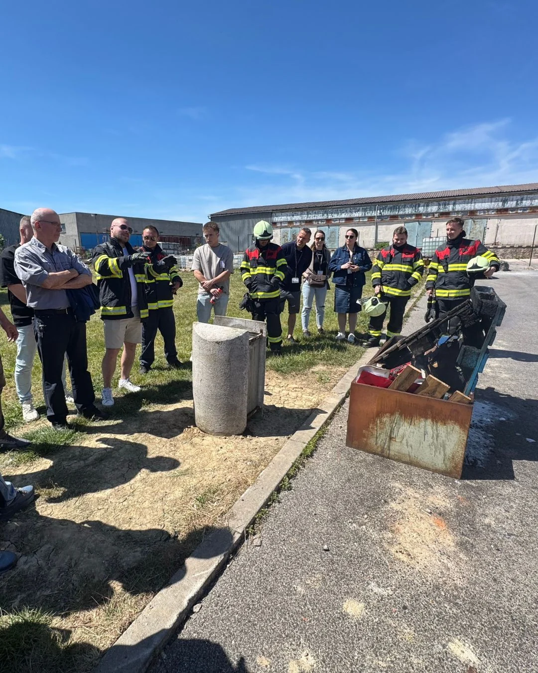 Participants discussing the simulated fire scenario during the robotics visit