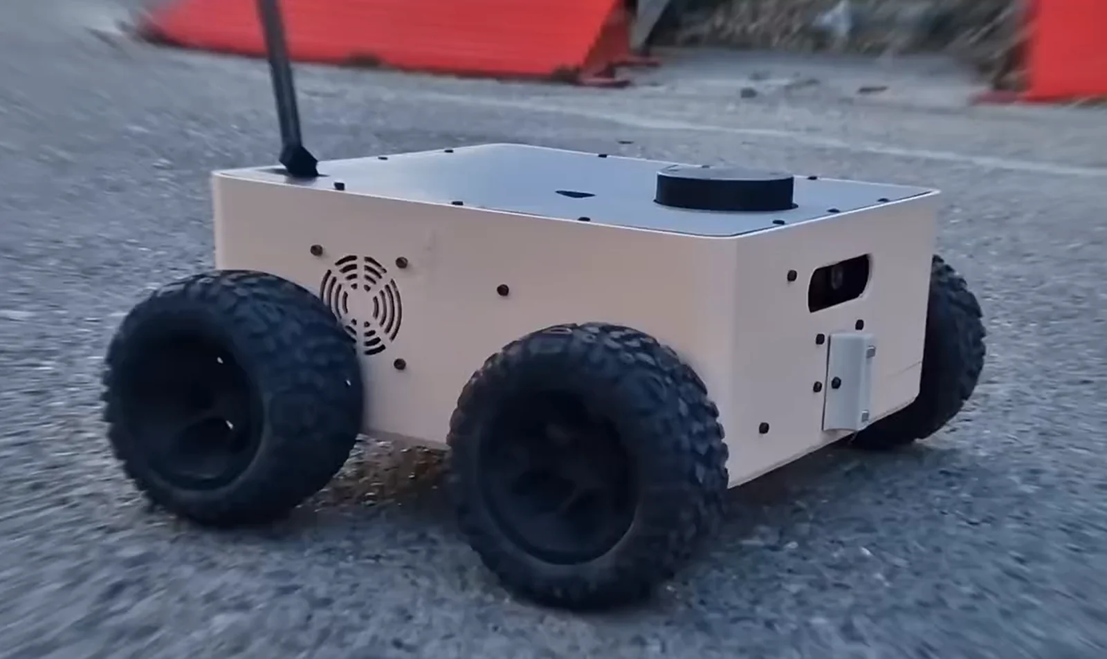 Four-wheeled SecuBot prototype with camera, LiDAR and control display